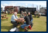 Having a drink and a chat behind the Grandstand